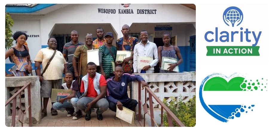 Trainees holding certificates outside the WESOFOD Kambia District office, in the banner artwork for Clarity’s “Inclusion in Action” series.